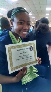 Elena with her "High Honor Roll with Distinction" awards.